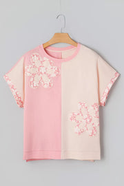 Color block cotton t-shirt with applique flowers and floral print sleeves.
