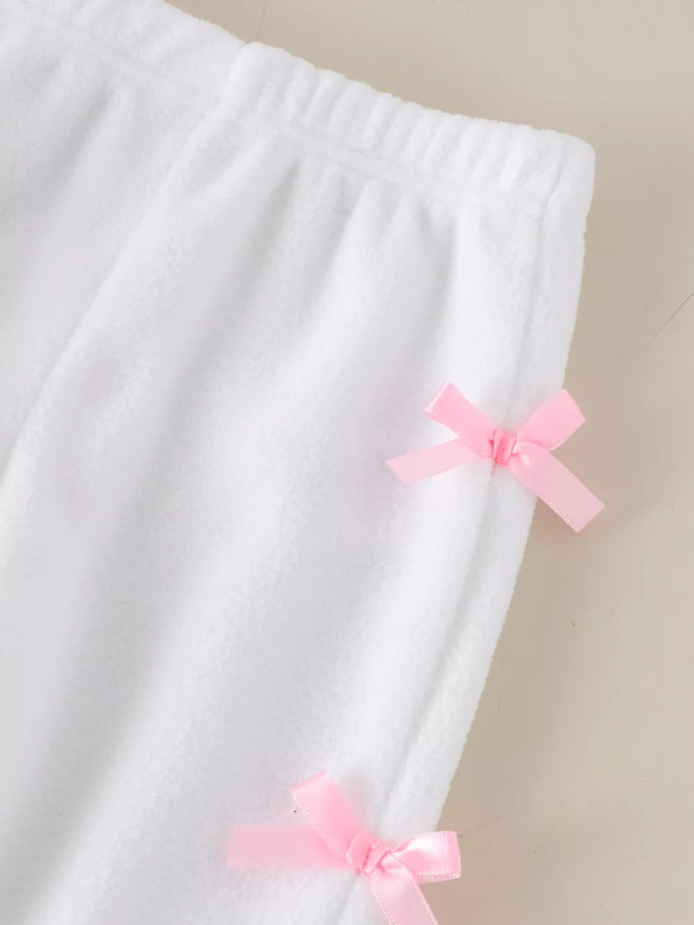 Children's Bow Round Neck Top And Pants Set in Pink, model styling view