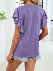 Purple tee with ruffled short sleeves and notched V-neck, paired with denim shorts.