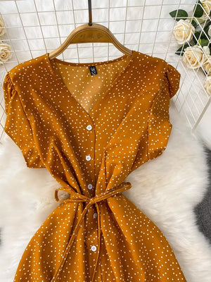 Dark Yellow polka dot maxi dress with V-neck, short sleeves, button front, and tie belt.