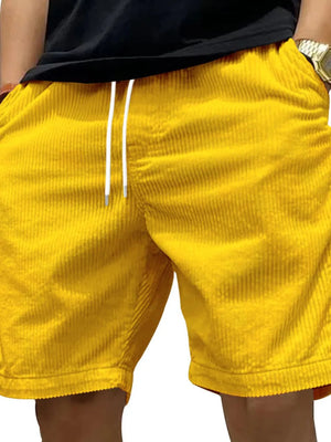 Gold corduroy drawstring shorts with a relaxed fit and white drawstrings.