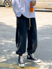 Black relaxed fit drawstring waist jeans with a comfortable casual style.