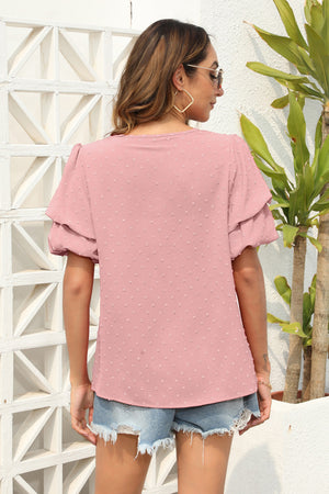 Dusty pink tiered sleeve Swiss dot blouse with a v-neckline.