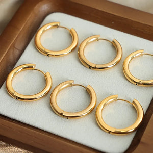 Sculpted gold hoop earrings, 18K gold-plated, casual everyday accessory.