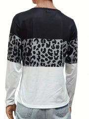 Long sleeve blocked top with leopard print and white sleeves.