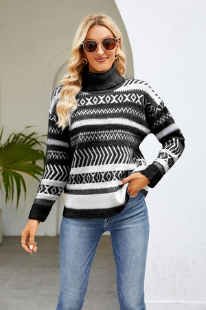 Geometric jacquard turtleneck sweater in black and white with a cozy fit.