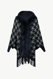 Houndstooth faux fur collar poncho with fringe detail in beige and black.