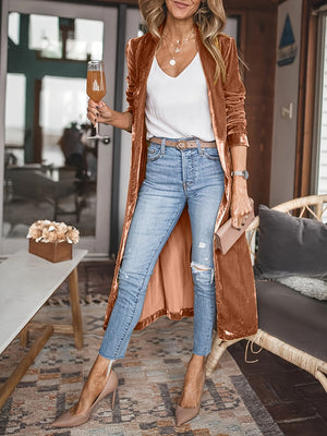 Velvet duster coat in Terracotta with fluid silhouette, open front, and long sleeves.