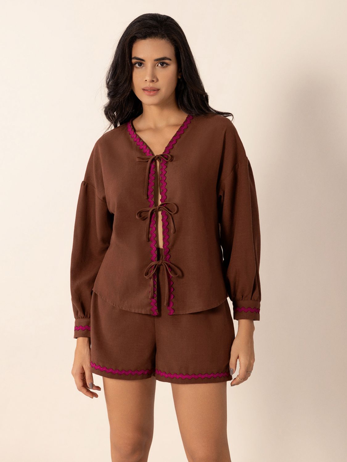 Brown linen tie-front pajama set with scallop trim and balloon sleeves.