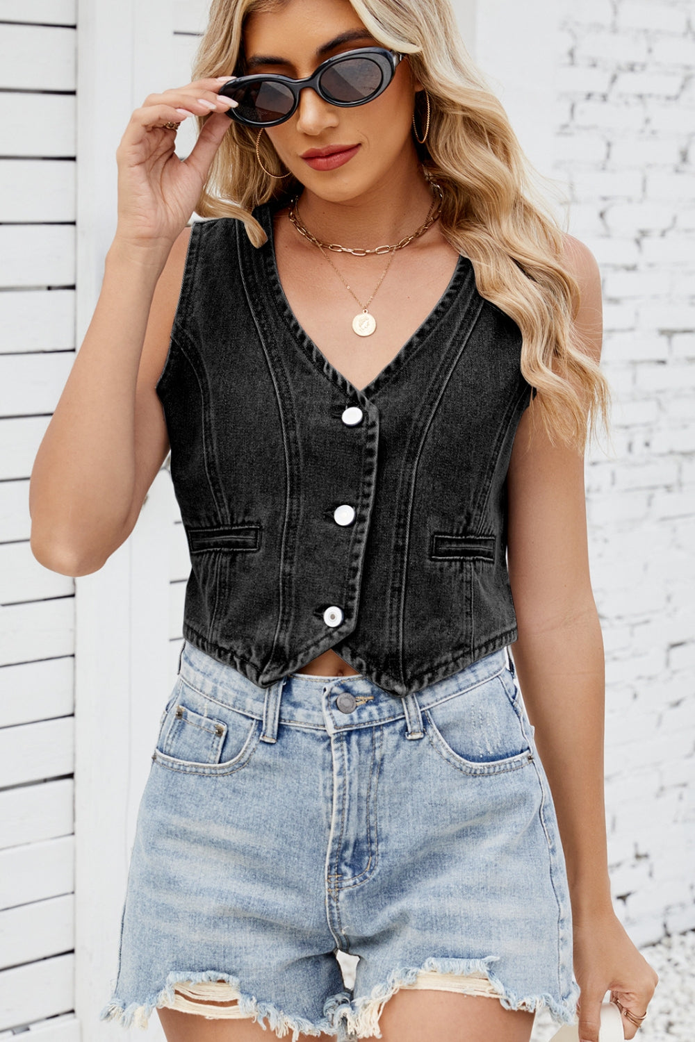 Black denim cropped vest with button front and v-neck