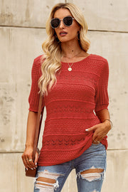 Rust openwork knit tee with short sleeves and a crew neck, featuring a textured pattern.