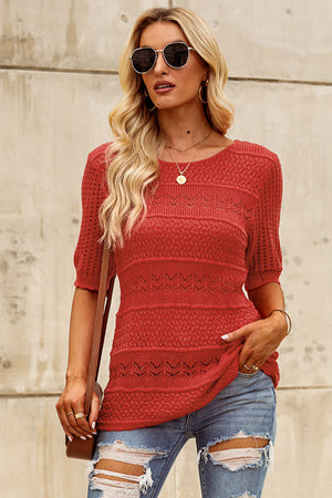 Rust openwork knit tee with short sleeves and a crew neck, featuring a textured pattern.