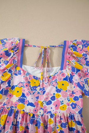 Floral mini dress with flutter sleeves, square neck, and tie back in cotton blend fabric.
