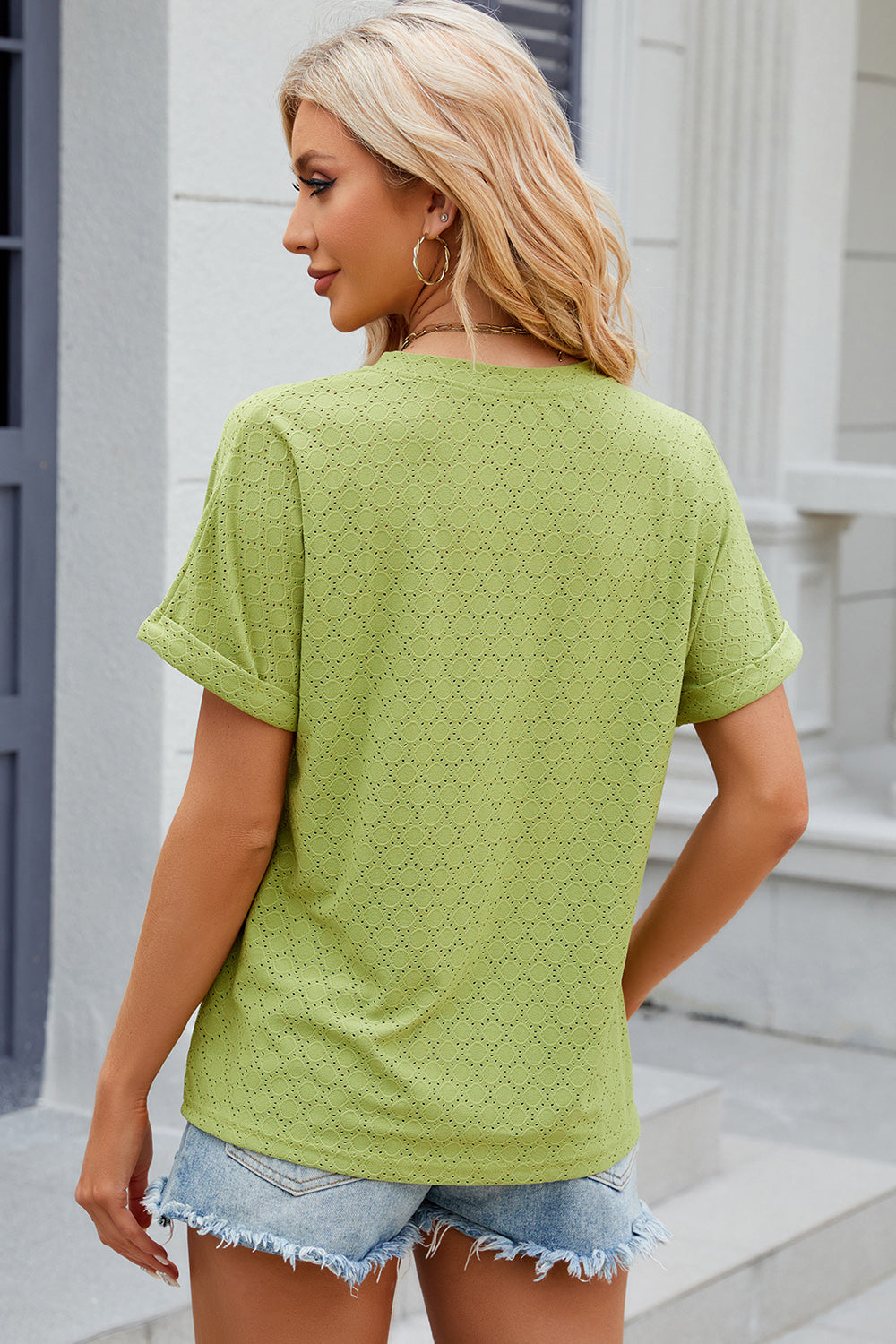 Light Green textured henley tee with rolled sleeves and allover eyelet pattern.