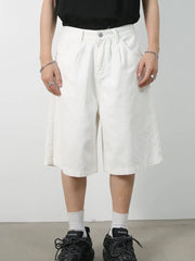 White pleated Bermuda shorts with a buttoned waist and relaxed fit.