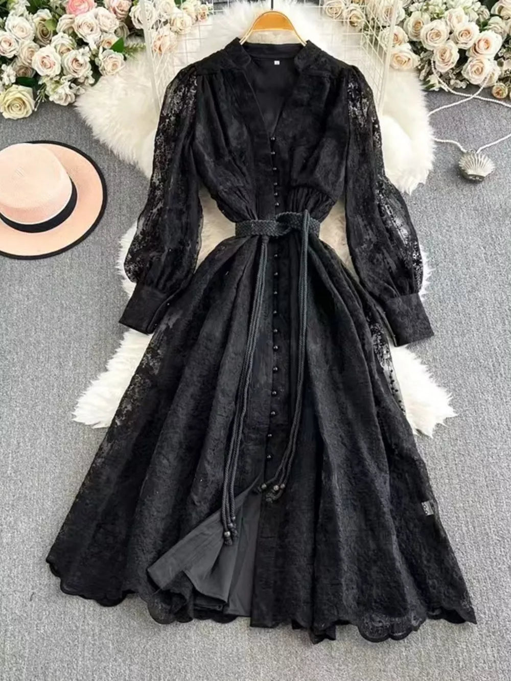 Black lace maxi dress with balloon sleeves, tie waist, and button front.