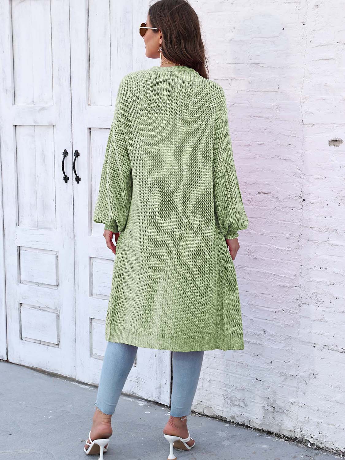Light green ribbed knit maxi cardigan with pockets and balloon sleeves.