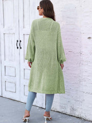 Light green ribbed knit maxi cardigan with pockets and balloon sleeves.