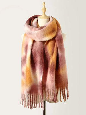 Watercolor wash fringe scarf in blush pink and brown with a soft, fuzzy texture.