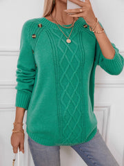 Green cable knit raglan sweater with button shoulder detail and crew neck.