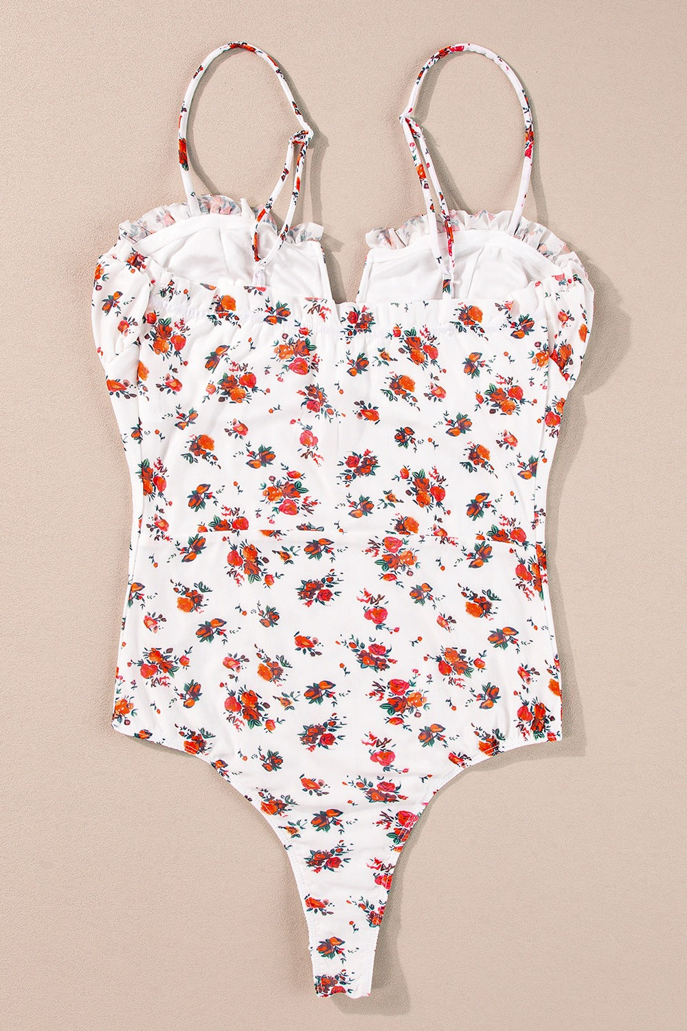 White floral bustier camisole with ruffle trim and adjustable straps