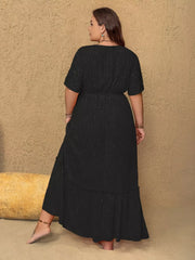 Plus size black V-neck maxi dress with metallic threads and tiered ruffle hem.