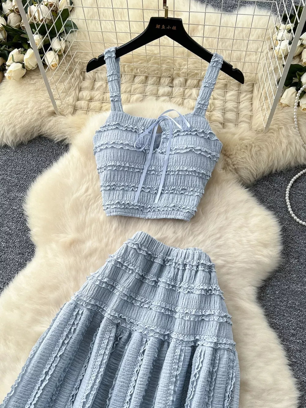 Blue ruched crop top with tie front and tiered maxi skirt set.