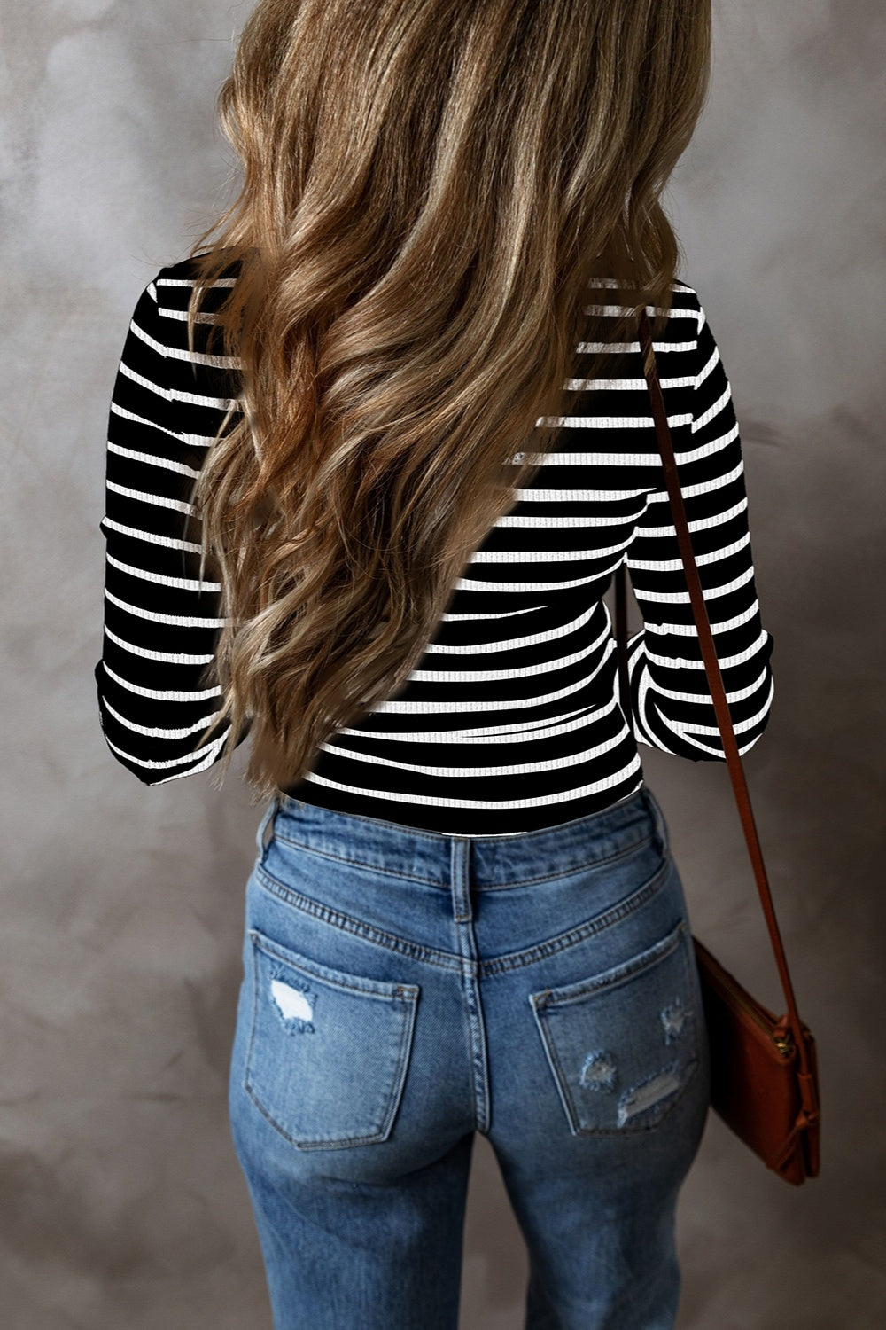 Black and white ribbed stripe long sleeve henley top with a crew neck.