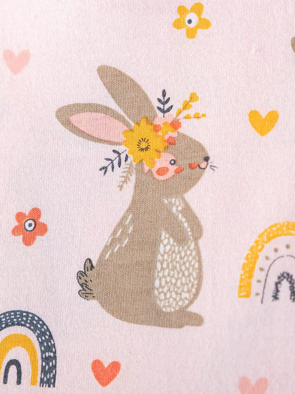 Baby dress in pink cotton with playful bunny, rainbow, and heart print.