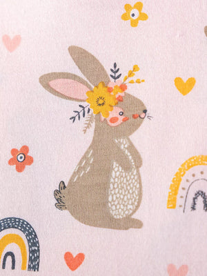 Baby dress in pink cotton with playful bunny, rainbow, and heart print.