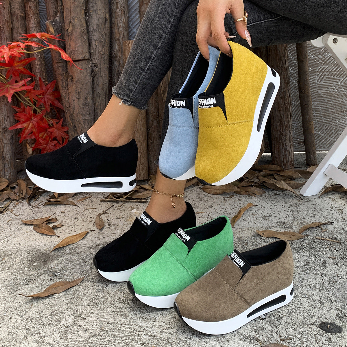 Round toe slip-on sneakers in black, green, sky blue, yellow, and dark brown with white platform soles.