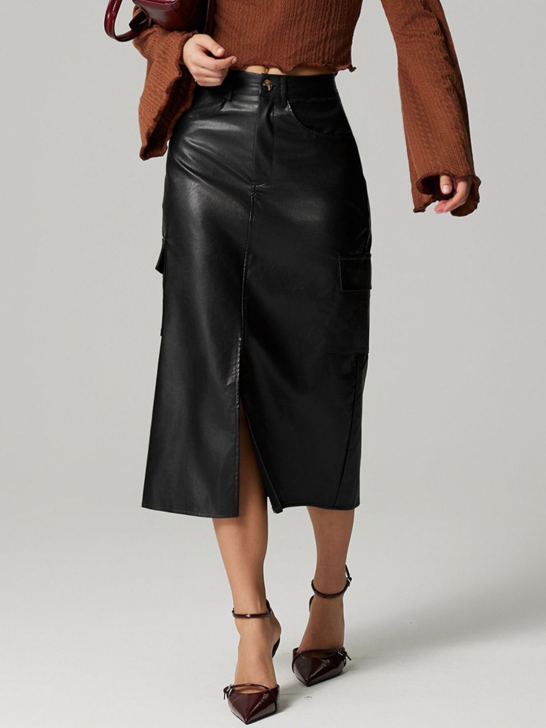 Black faux leather midi skirt with cargo pockets and front slit
