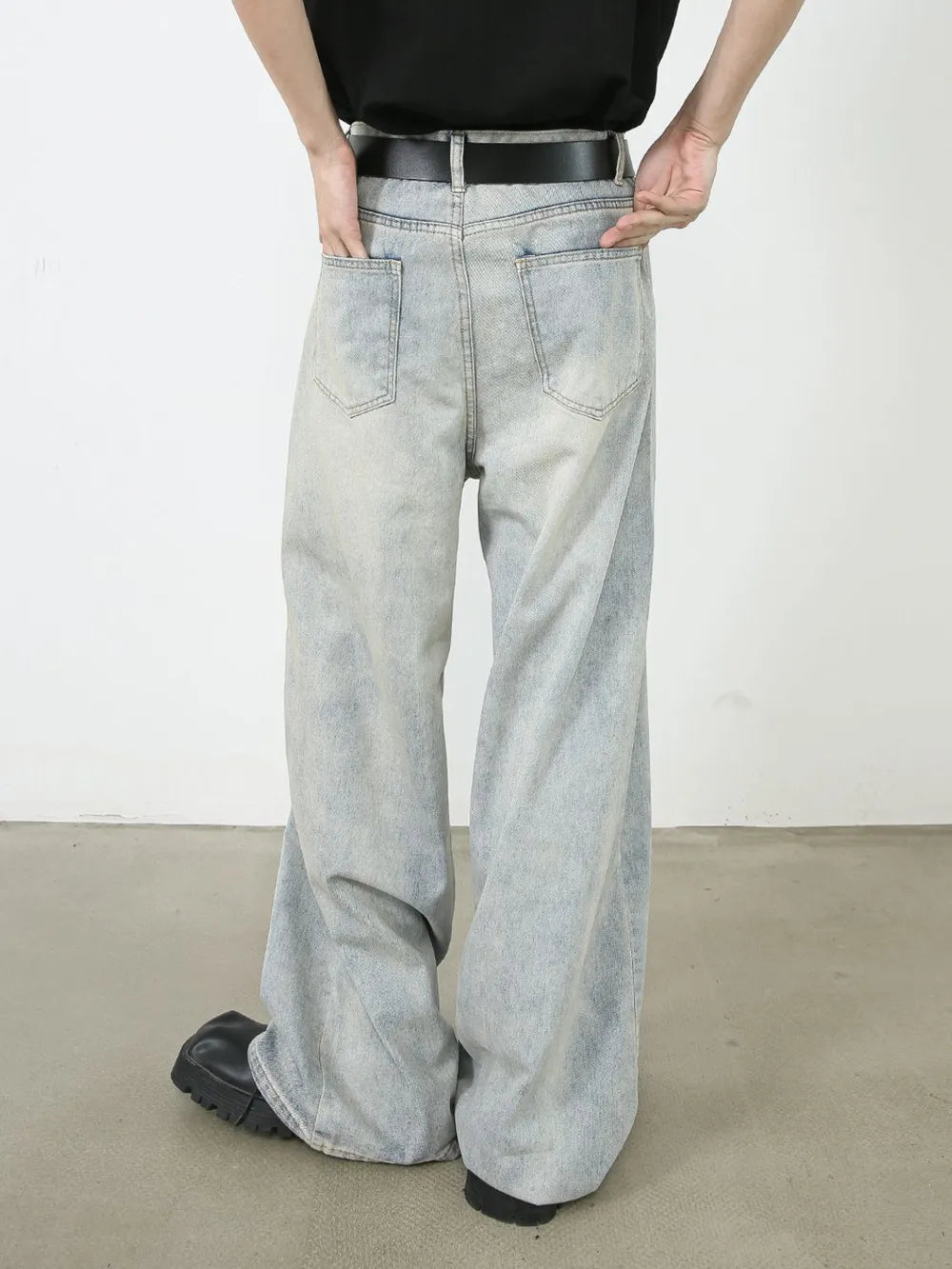 Light faded denim palazzo jeans with relaxed, oversized fit and wide leg
