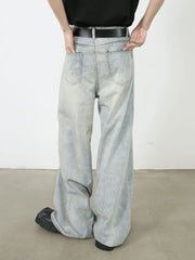 Light faded denim palazzo jeans with relaxed, oversized fit and wide leg