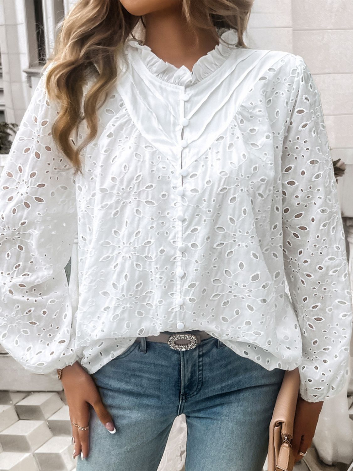 White eyelet embroidered blouse with ruffle collar and button front.