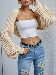 Beige balloon sleeve cropped knit cardigan with ribbed texture and wide cuffs.