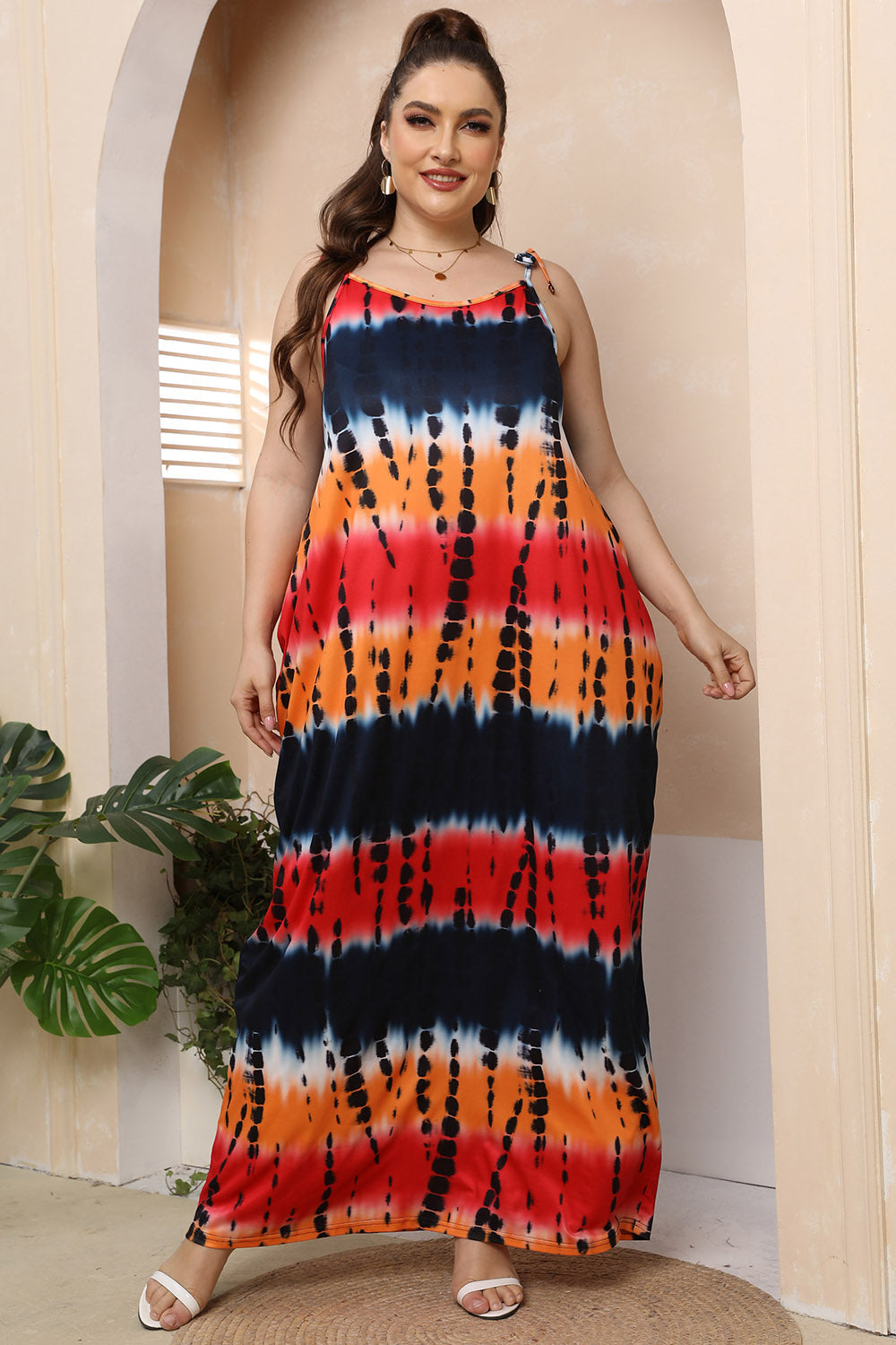 Multicolor tie-dye maxi dress with adjustable tie straps and a relaxed fit.