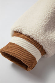 Sherpa bomber jacket sleeve detail with brown and cream striped ribbed cuff