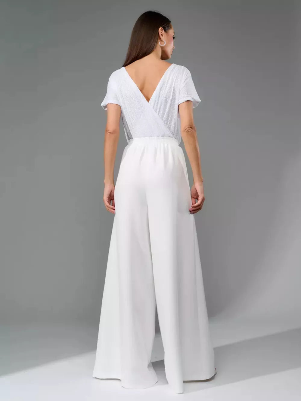 White sequin wrap top jumpsuit with wide-leg pants