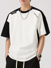 Color block t-shirt with black sleeves and white body, round neck, cotton blend.
