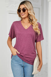 Drape-front v-neck tee in deep purple with short dolman sleeves and side ruching detail.