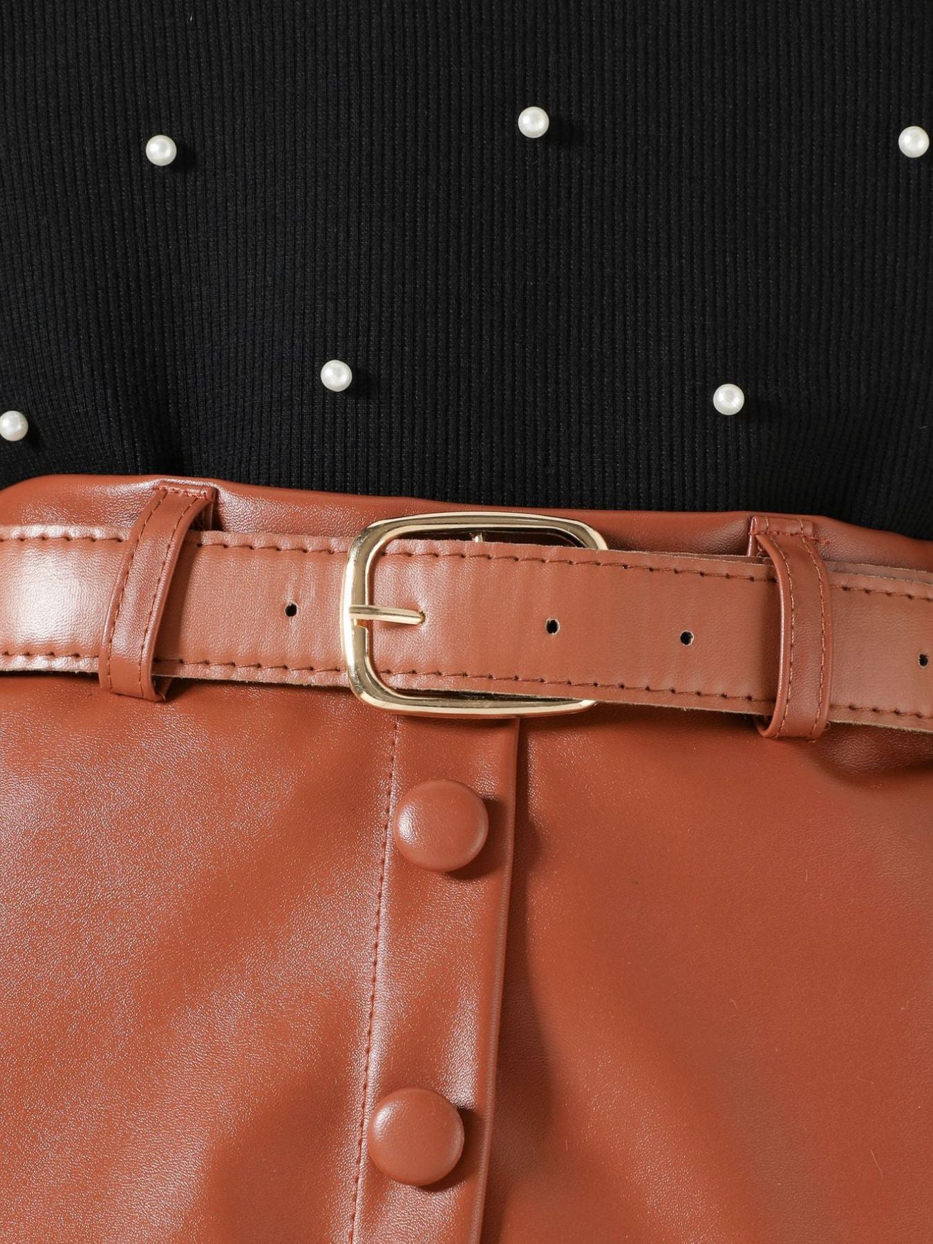 Black pearl-embellished top with brown faux leather skirt and belt