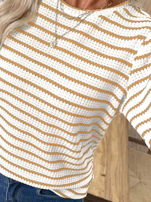 Textured knit long-sleeve t-shirt in white with thin orange stripes.