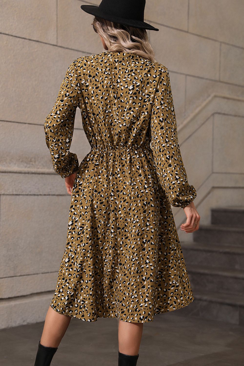 Olive animal print midi dress with gathered waist and long sleeves.