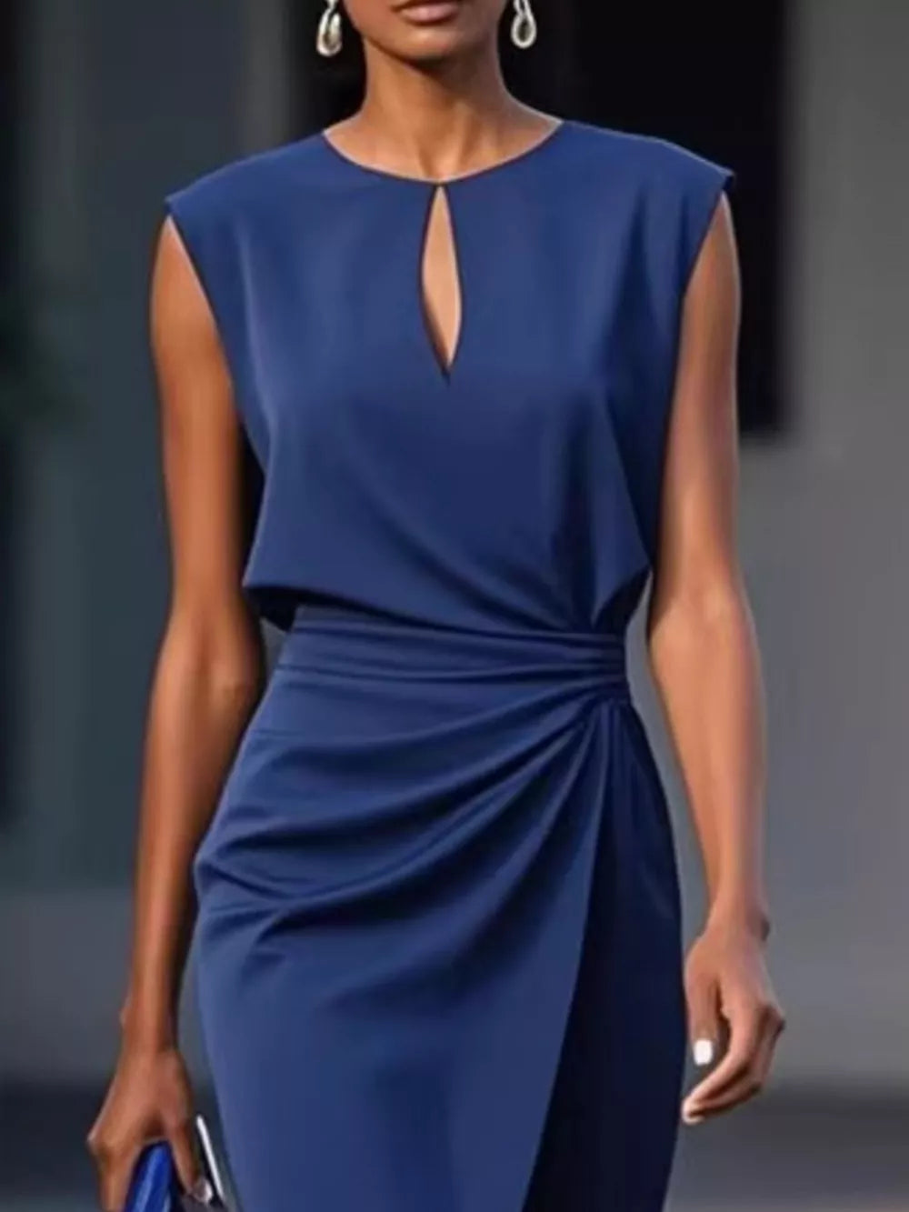 Navy ruched sheath dress with keyhole neckline and cap sleeves.