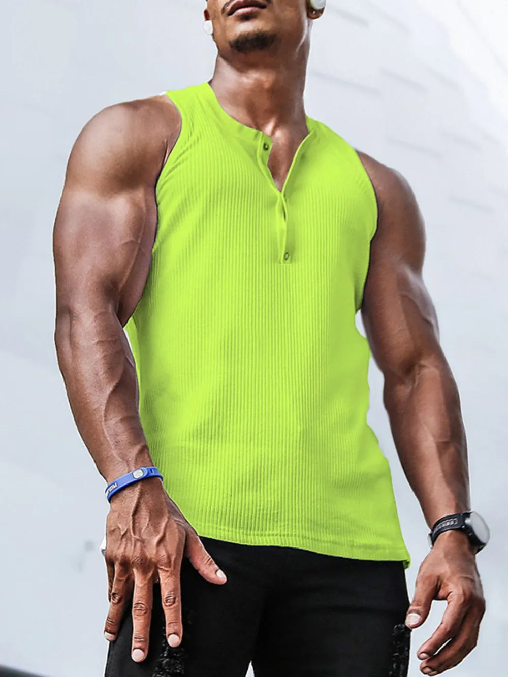 Ribbed henley muscle tank in neon green with button detail and sleeveless cut.
