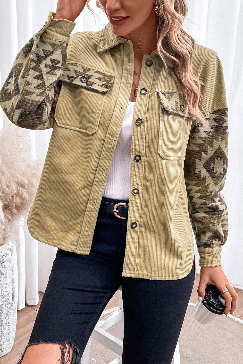 Corduroy jacket in chartreuse with Aztec print sleeves and chest pockets.