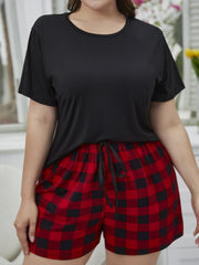 Relaxed black tee and red plaid shorts set with drawstring waist