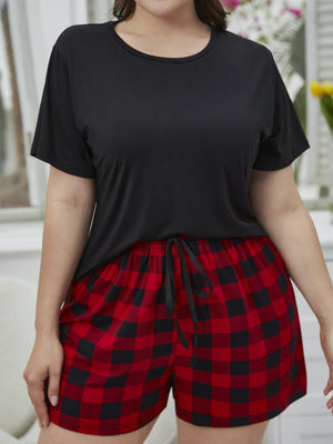 Relaxed black tee and red plaid shorts set with drawstring waist