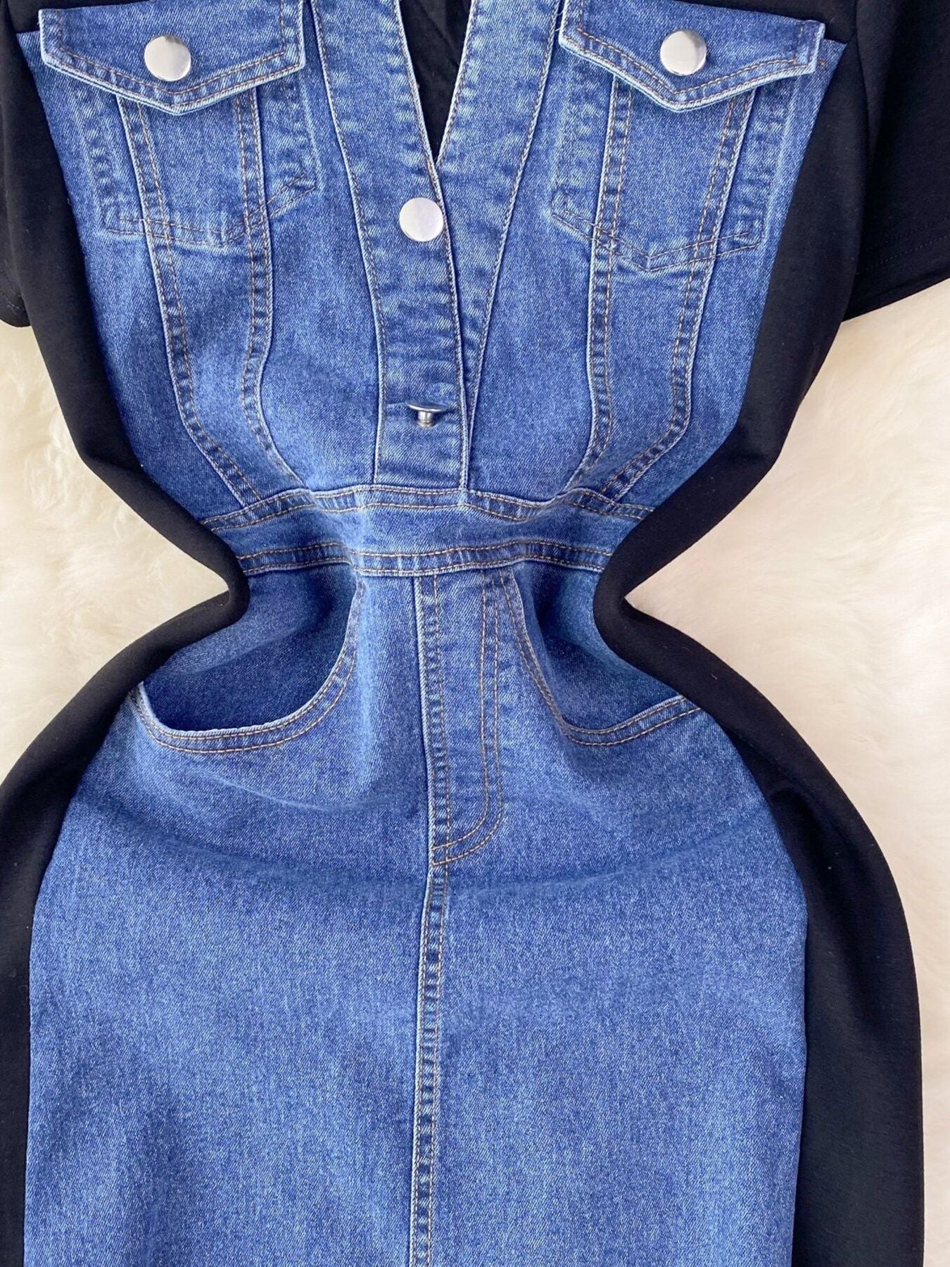 Denim patchwork short-sleeve dress with button-down front and black side panels.